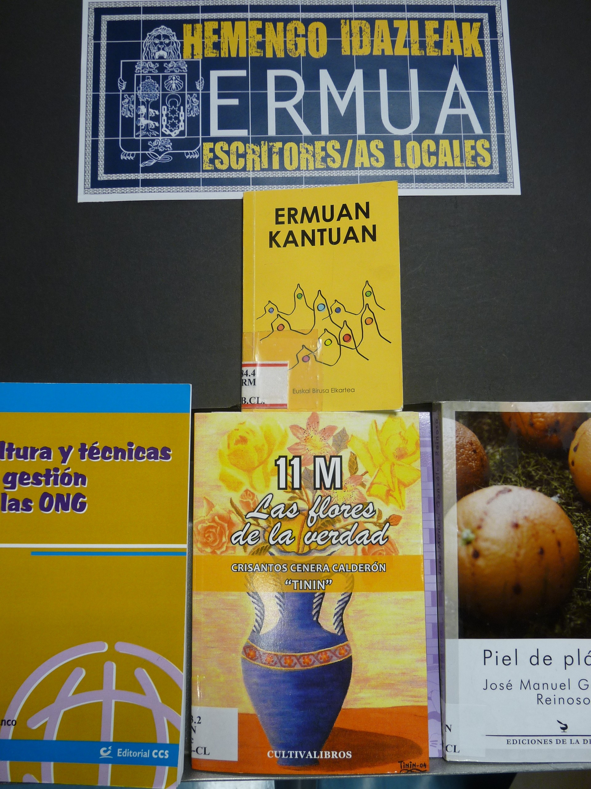 Cartel con algunos títulos de autores/as locales